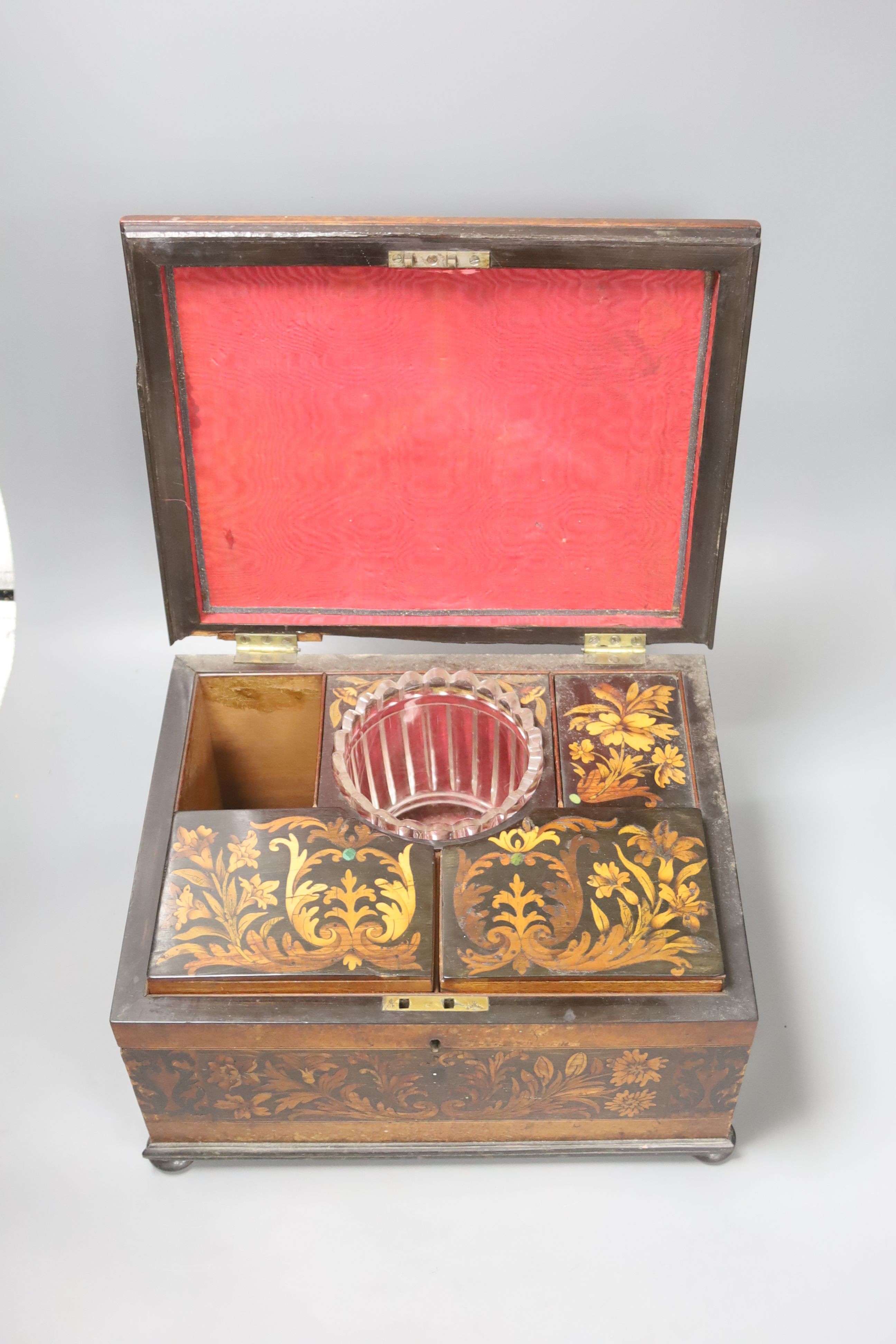 An unusual George IV ebony and marquetry inlaid tea caddy, 32cm